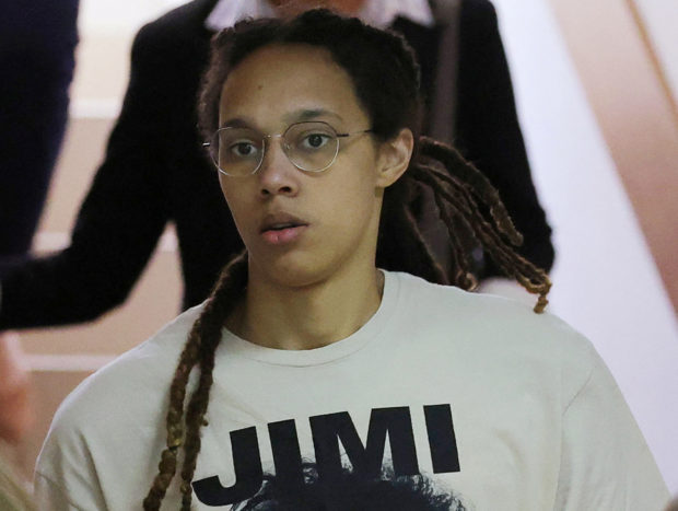 FILE PHOTO: U.S. basketball player Brittney Griner, who was detained in March at Moscow's Sheremetyevo airport and later charged with illegal possession of cannabis, is escorted before a court hearing in Khimki outside Moscow, Russia July 1, 2022. REUTERS/Evgenia Novozhenina