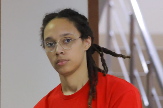 U.S. basketball player Brittney Griner, who was detained in March at Moscow's Sheremetyevo airport and later charged with illegal possession of cannabis, is escorted before a court hearing in Khimki, outside Moscow, Russia July 7, 2022. REUTERS/Evgenia Novozhenina