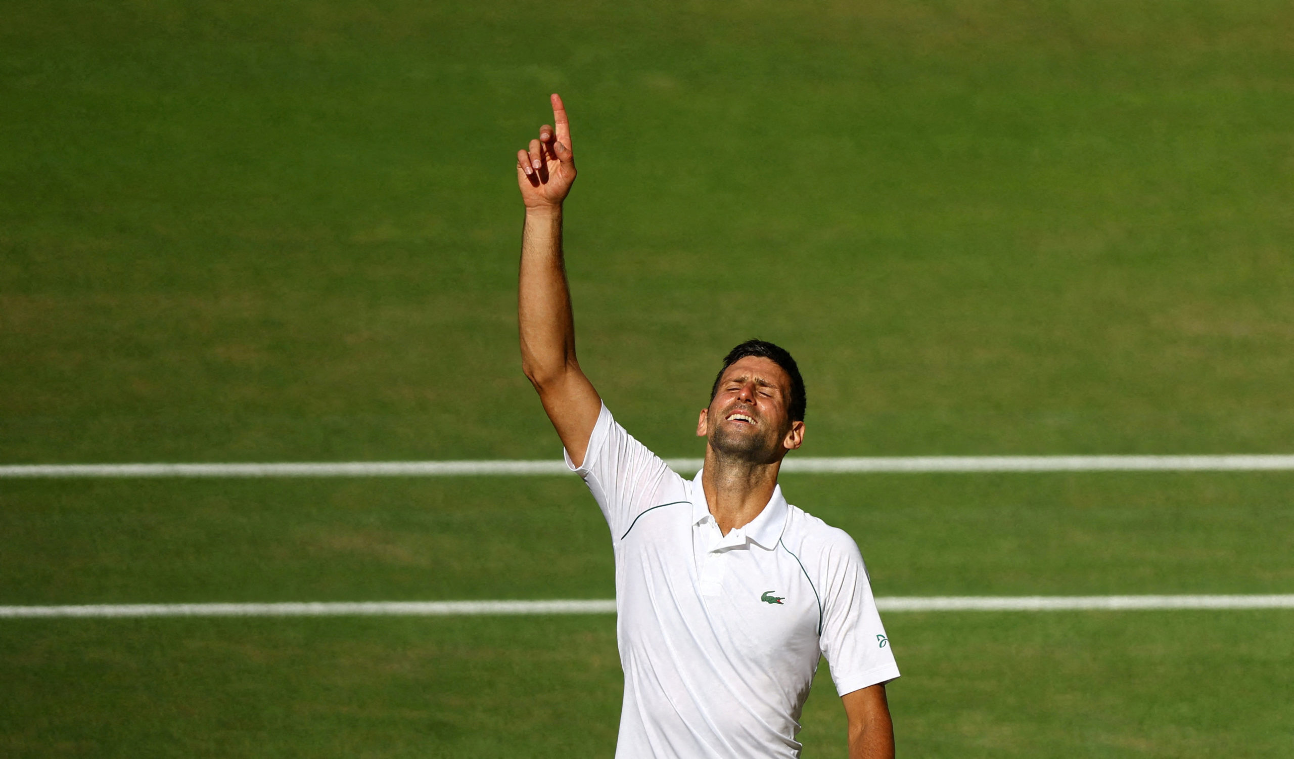 Serbia's Novak Djokovic celebrates after winning the men's singles final against Australia's Nick Kyrgios