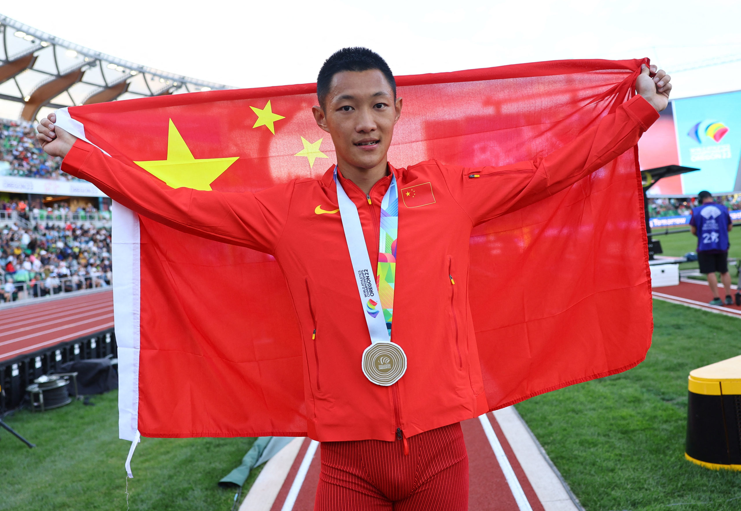 Gold medalist China's Wang Jianan celebrates after winning the men's long jump final