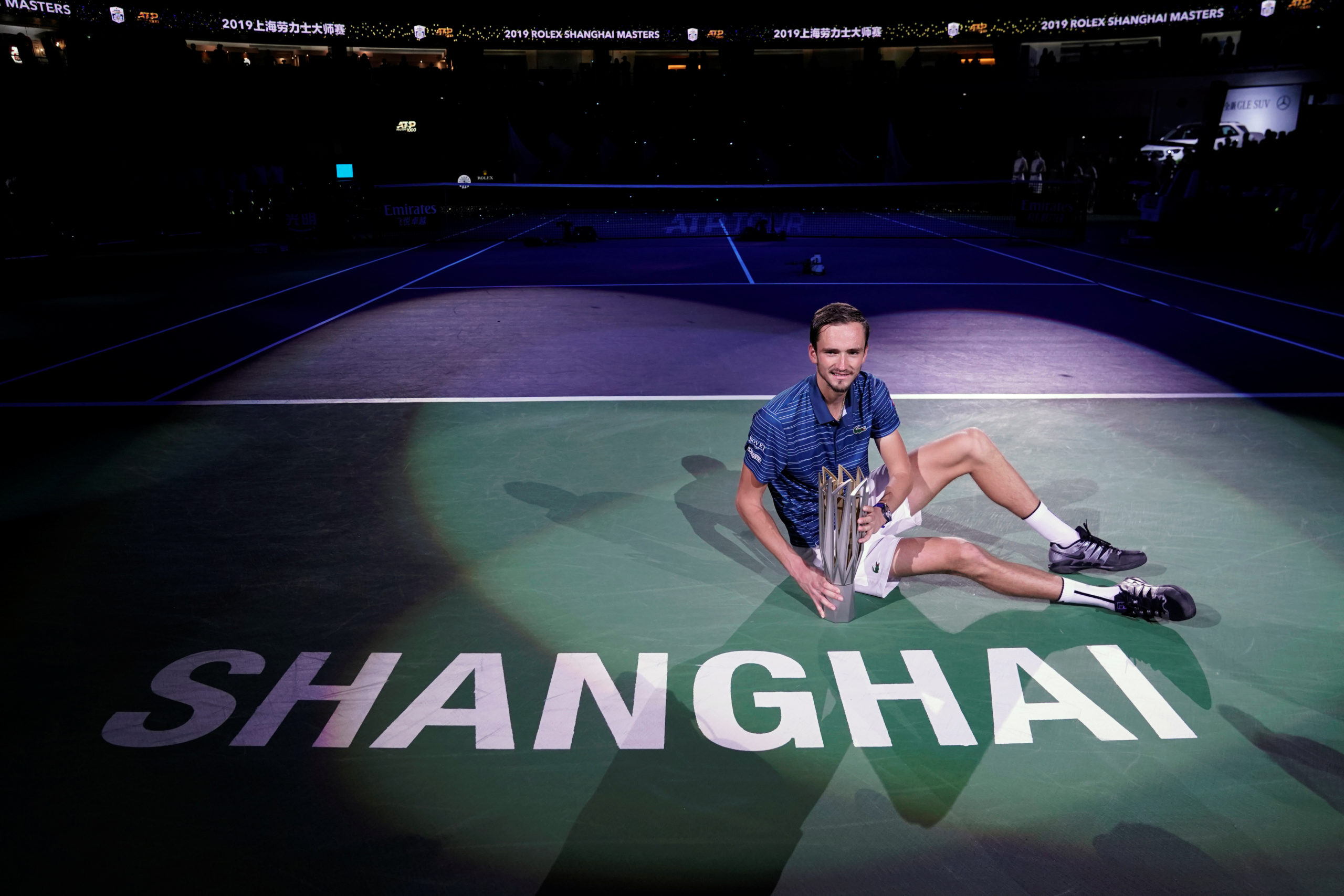 Daniil Medvedev of Russia celebrates winning Shanghai Masters with his trophy.
