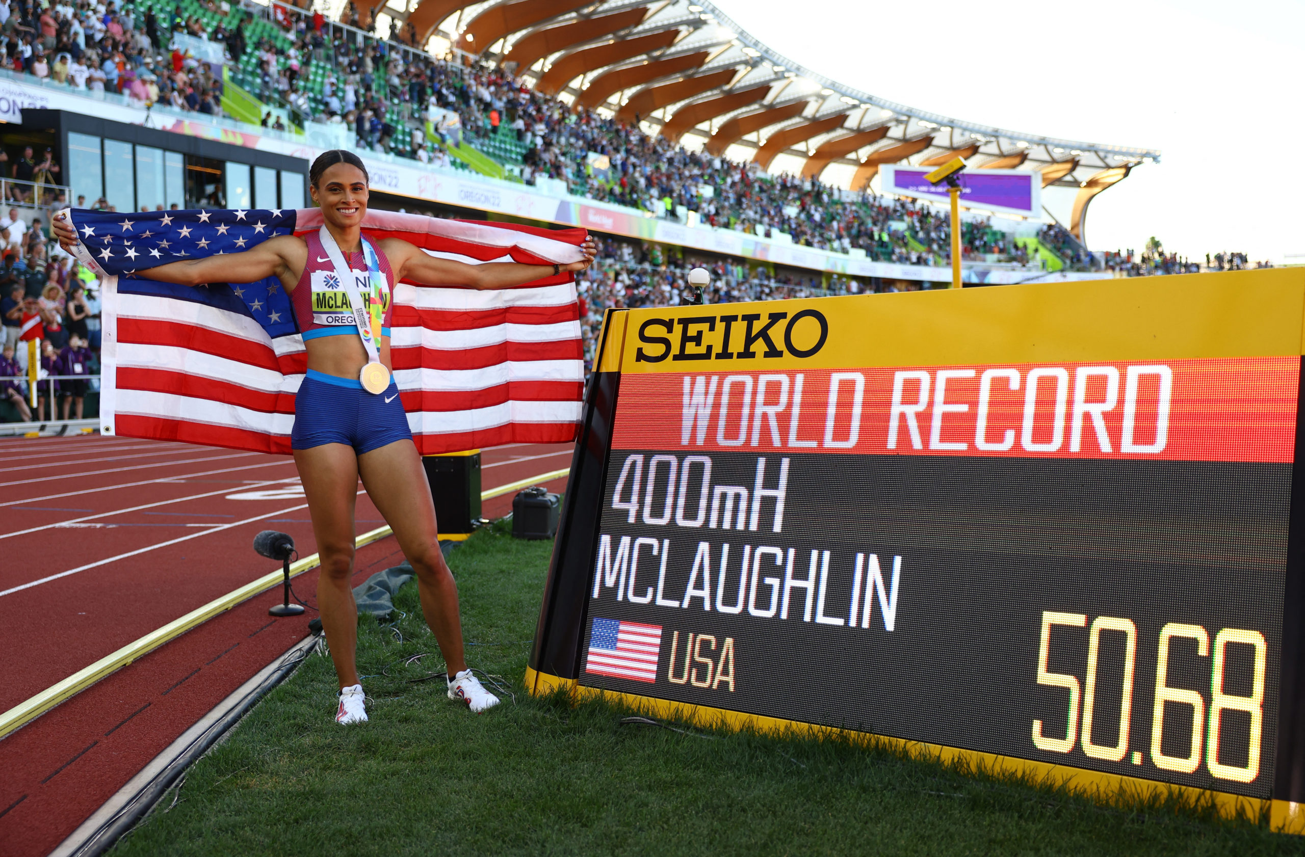 Gold medallist Sydney McLaughlin of the U.S. celebrates after winning the women's 400 metres hurdles final and setting a new world record Athletics - World Athletics Championships - Women's 400 Metres Hurdles - Final - Hayward Field, Eugene, Oregon, U.S.