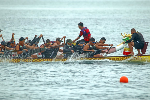 Paddlers of the Philippine Army Dragon Warriors. STORY: Army rowers dominate Siargao dragon boat race