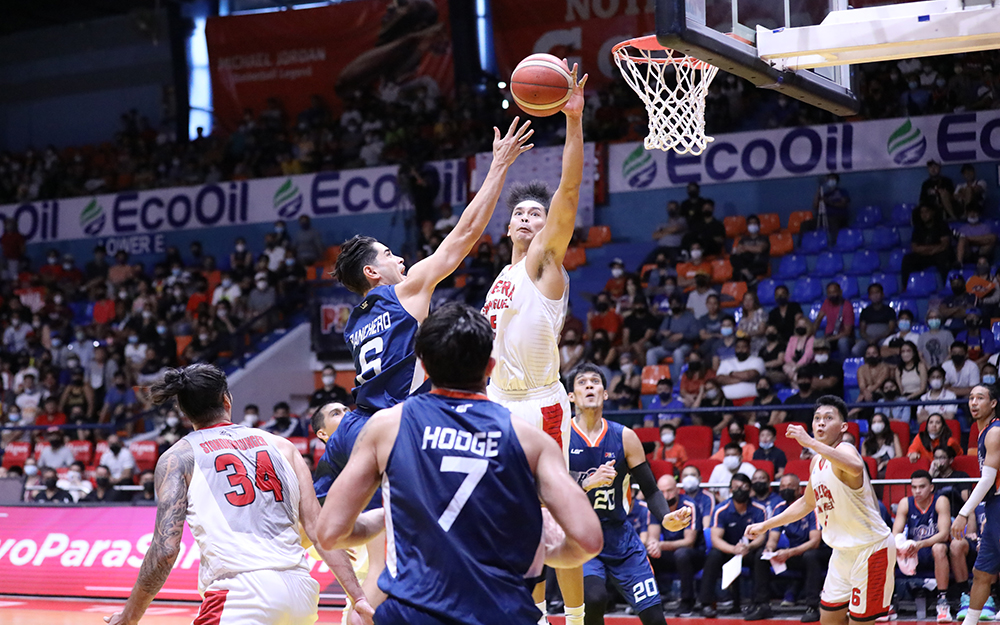 Japeth Aguilar (right) stood out on both ends as he smothers a Chris Banchero layup here.
