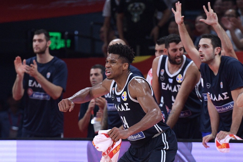 FILE – Greece's Giannis Antetokounmpo (C) reacts to a point during the Basketball World Cup Group K second round game between Czech Republic and Greece in Shenzhen on September 9, 2019.