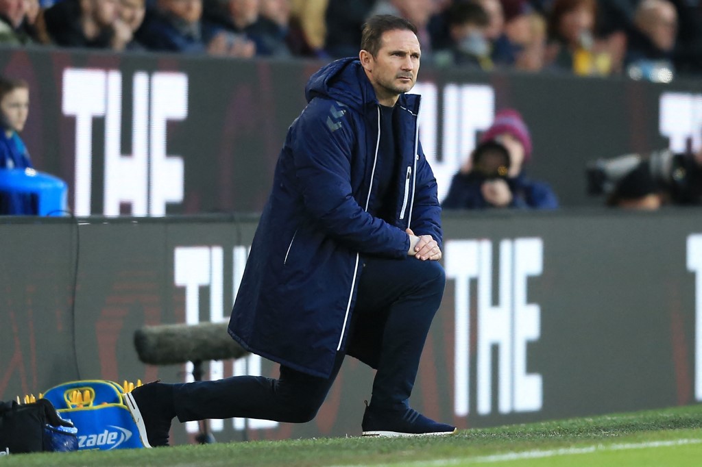 Everton's English manager Frank Lampard takes a knee in support of the Premier League's No Room For Racism campaign ahead of the English Premier League football match between Burnley and Everton at Turf Moor in Burnley, north west England on April 6, 2022.