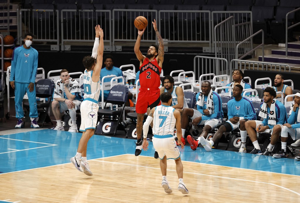 FILE– Jalen Harris #2 of the Toronto Raptors attempts a shot against Nate Darling #30 of the Charlotte Hornets during the second half of their game at Spectrum Center on December 12, 2020 in Charlotte, North Carolina.
