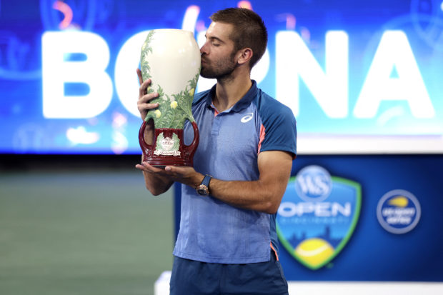 Borna Coric of Croatia celebrates after defeating Stefanos Tsitsipas of Greece in their Men's Singles Final match on day nine of the Western & Southern Open at Lindner Family Tennis Center on August 21, 2022 in Mason, Ohio. Coric defeated Tsitsipas with a score of 7-6, 6-2. Matthew Stockman/Getty Images/AFP (Photo by MATTHEW STOCKMAN / GETTY IMAGES NORTH AMERICA / Getty Images via AFP)