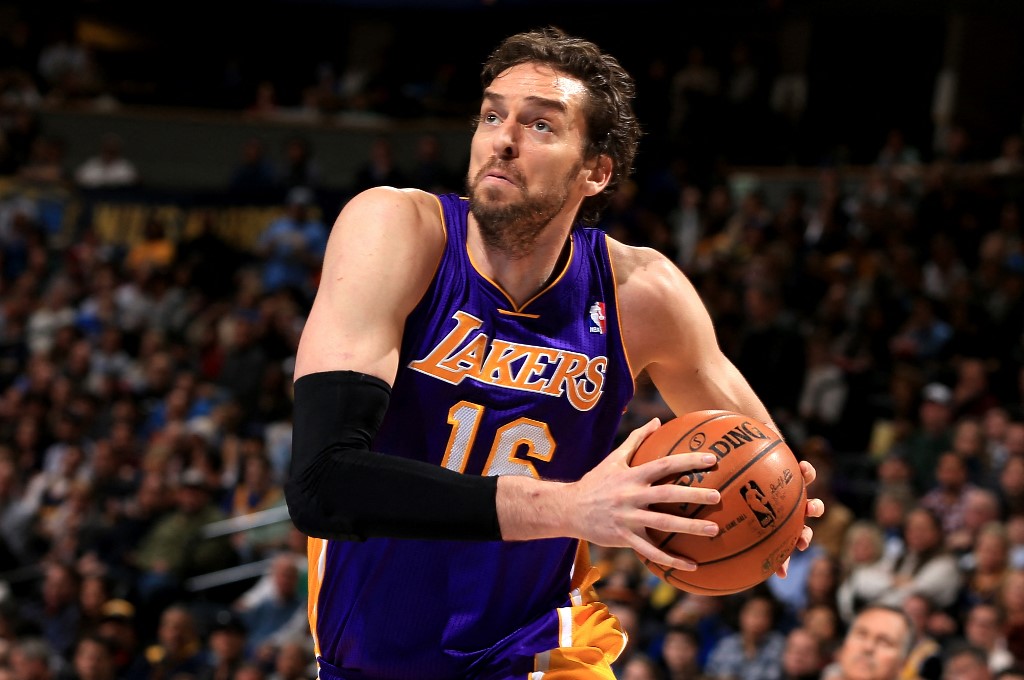 Pau Gasol #16 of the Los Angeles Lakers drives to the basket against the Denver Nuggets at Pepsi Center on December 26, 2012 in Denver, Colorado. 