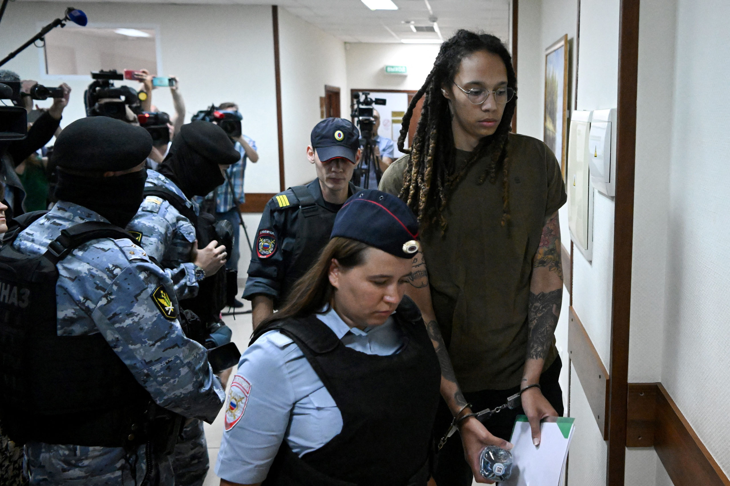 U.S. basketball player Brittney Griner, who was detained at Moscow's Sheremetyevo airport and later charged with illegal possession of cannabis, is escorted before a court hearing in Khimki outside Moscow, Russia August 2, 2022. 