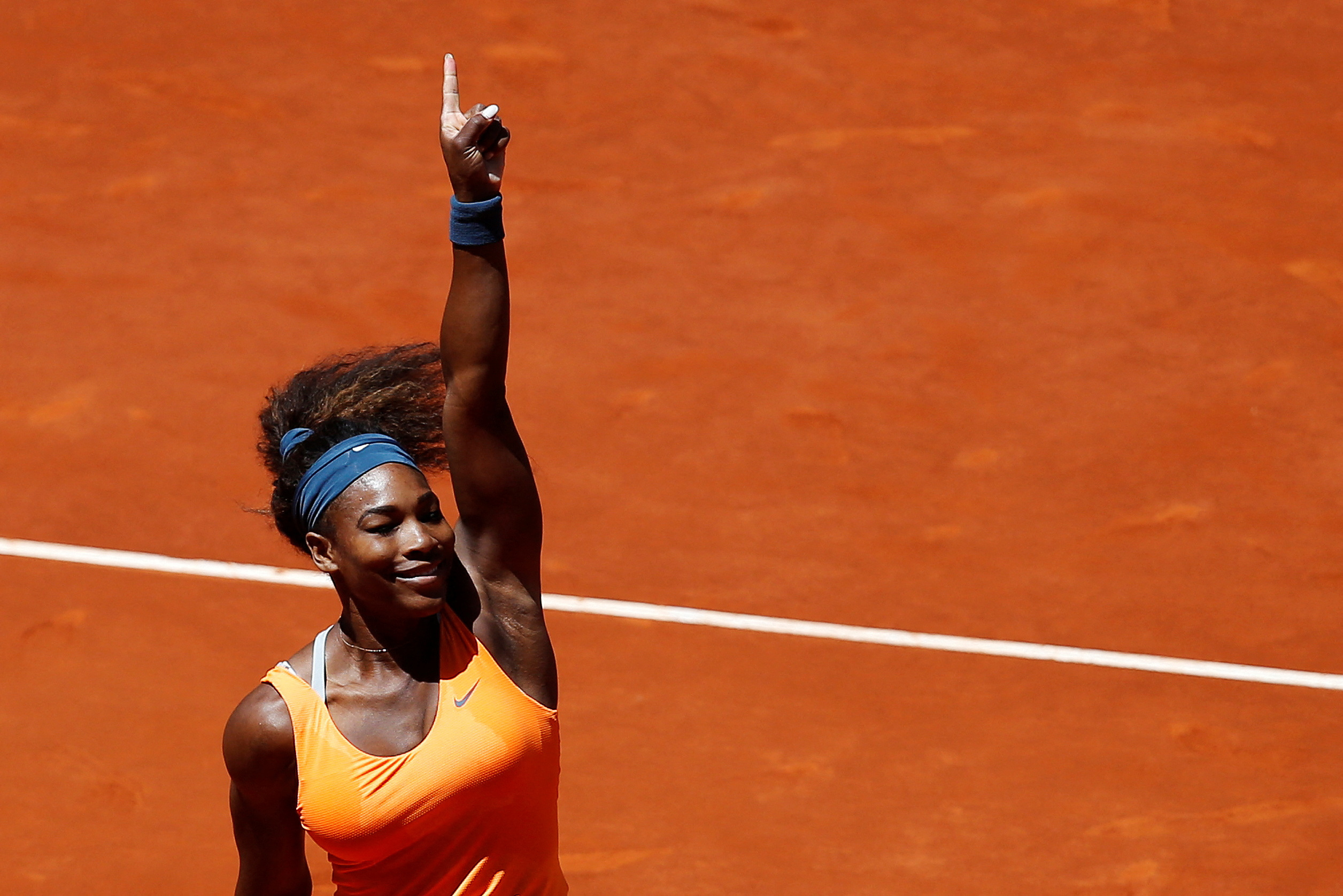FILE PHOTO: Serena Williams of the U.S. celebrates her victory against Maria Sharapova of Russia at the end of their women's singles final match at the Madrid Open tennis tournament in Madrid May 12, 2013.