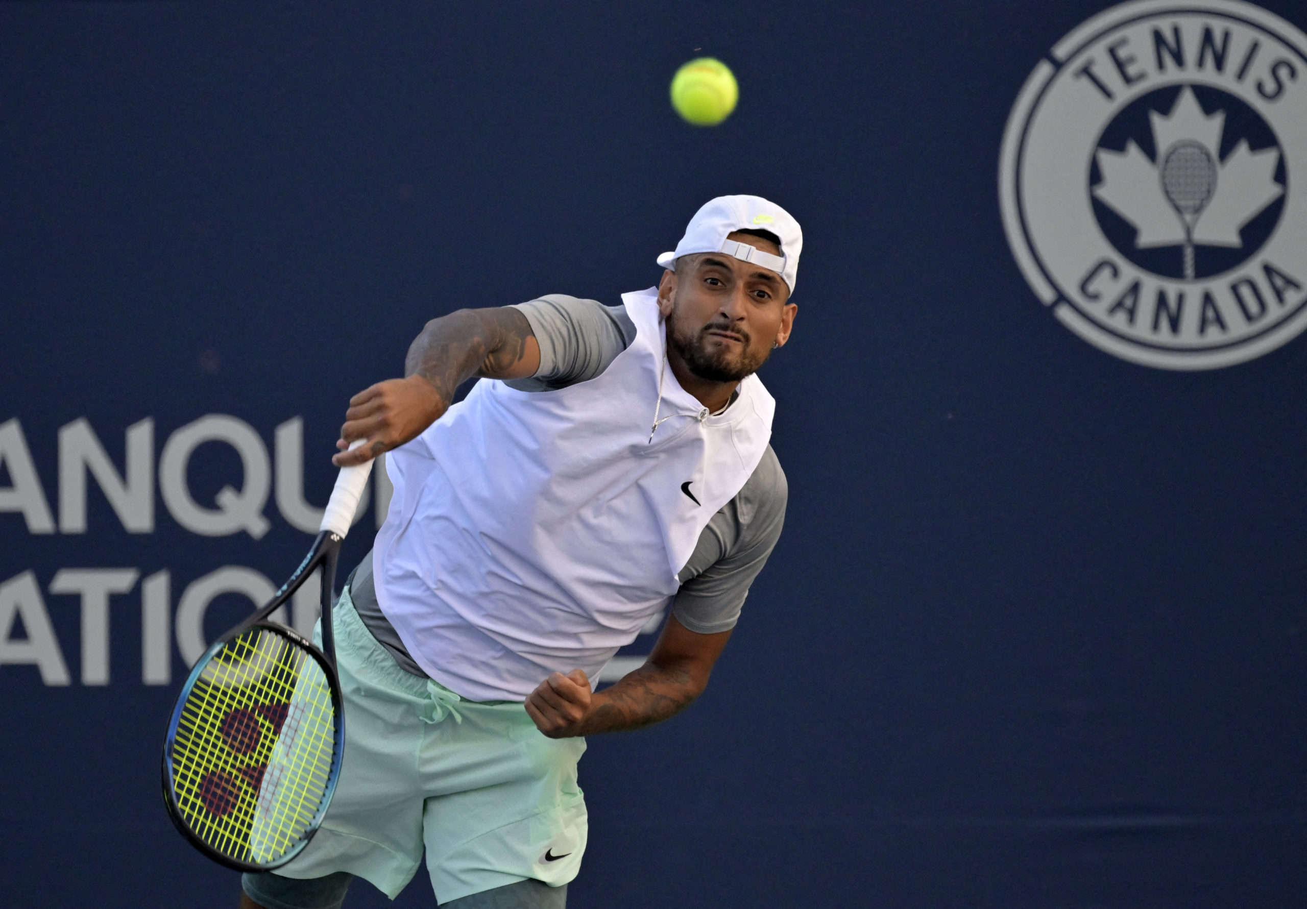 Aug 11, 2022; Montreal, QC, Canada; Nick Kyrgios (AUS) serves against Alex De Minaur (AUS) (not pictured) in third round play in the National Bank Open at IGA Stadium. 