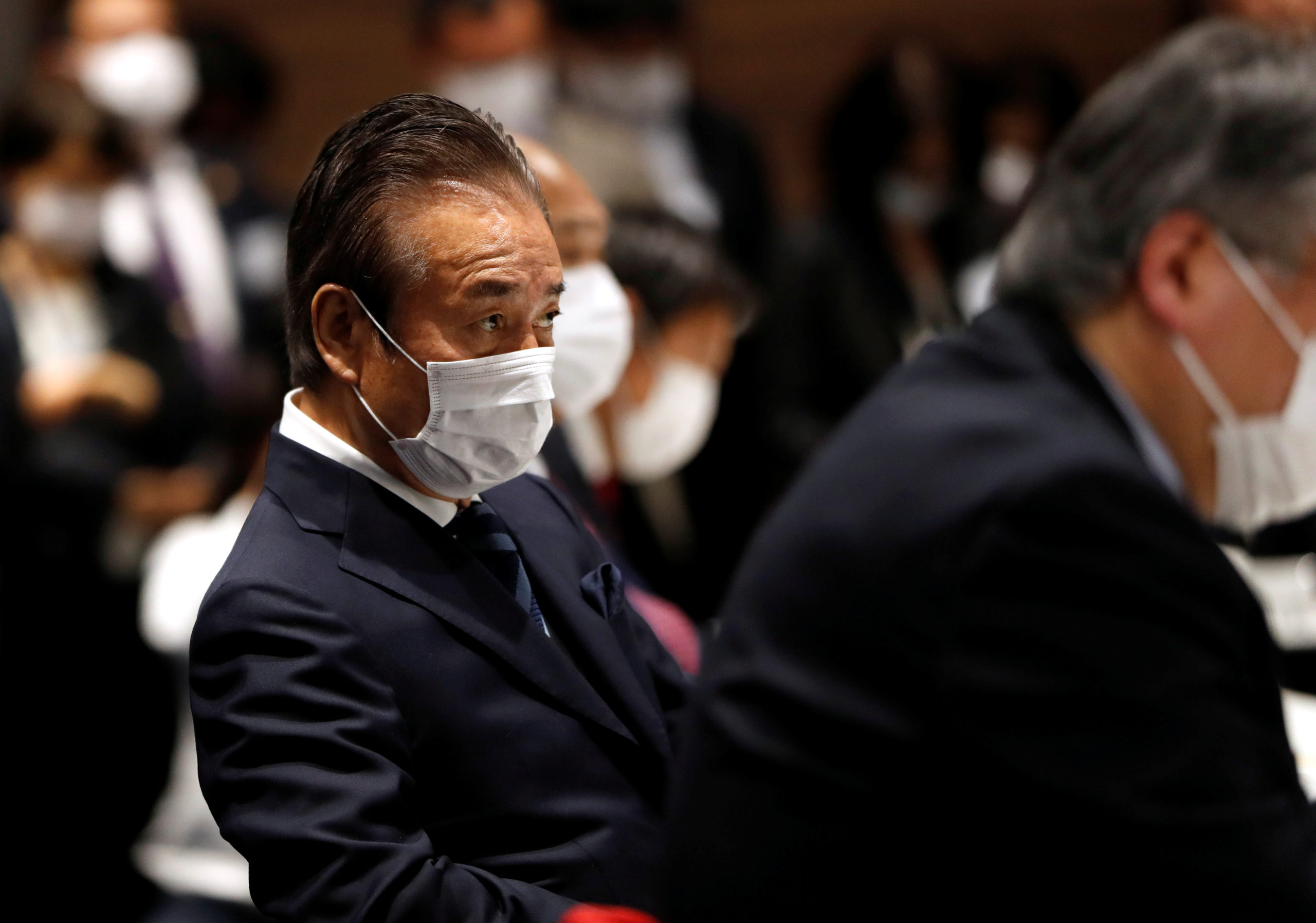 FILE PHOTO: The Tokyo Organising Committee of the Olympic and Paralympic Games (Tokyo 2020) Executive Board member Haruyuki Takahashi, wearing a protective face mask following an outbreak of the coronavirus disease (COVID-19), is seen during Tokyo 2020 Executive Board Meeting in Tokyo, Japan March 30, 2020.