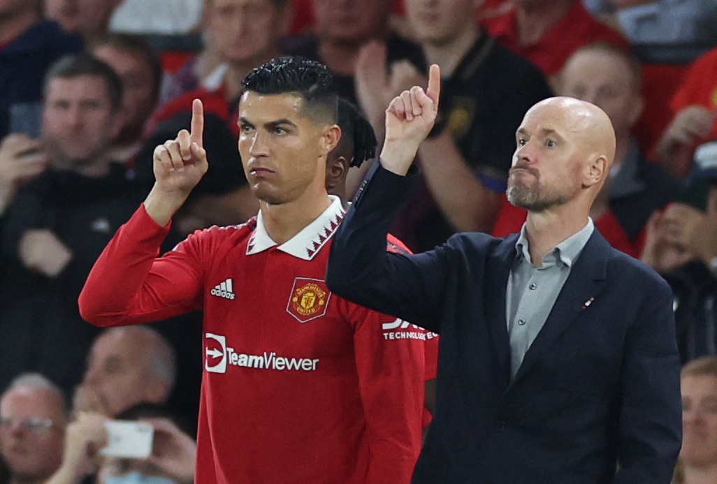 FILE PHOTO: Soccer Football - Premier League - Manchester United v Liverpool - Old Trafford, Manchester, Britain - August 22, 2022 Manchester United's Cristiano Ronaldo with manager Erik ten Hag before coming on as a substitute 
