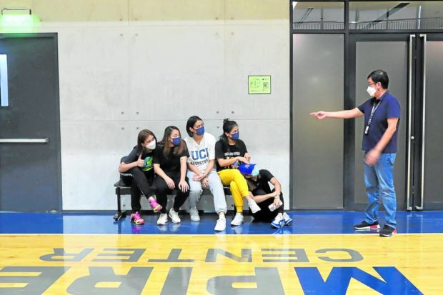 National U stars (from left) Mhicaela Belen, Princess Robles, Alyssa Solomon, Joyme Cagande and Jen Nierva discuss with team manager Bing See Diet potential next steps for the Lady Bulldogs. —FRANCIS T. J. OCHOA