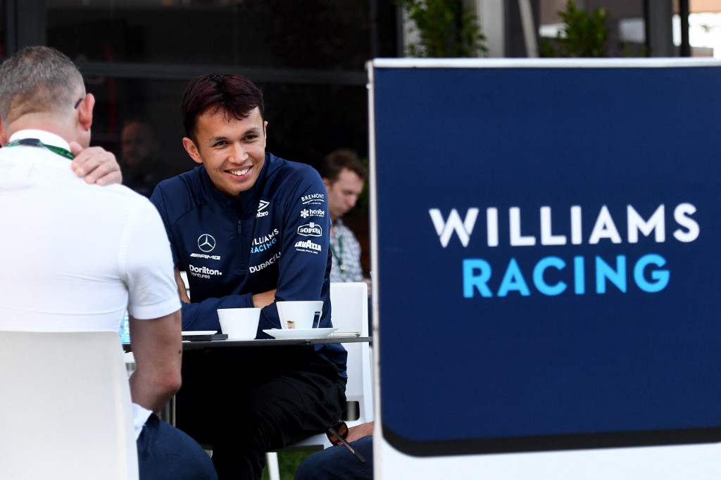 FILE–Williams British driver Alex Albon evjoys his tea at the Albert Park Circuit in Melbourne on April 7, 2022, ahead of the 2022 Formula One Australian Grand Prix. 