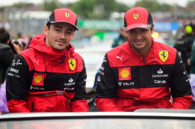 Ferrari's Monegasque driver Charles Leclerc (L) and Ferrari's Spanish driver Carlos Sainz Jr attend the drivers parade ahead of the Formula One Hungarian Grand Prix at the Hungaroring in Mogyorod near Budapest, Hungary, on July 31, 2022.