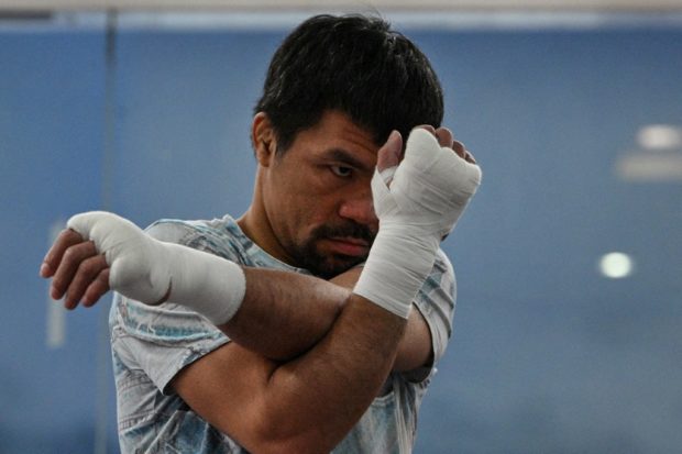 In this file photo taken on June 22, 2021 shows Philippine boxing legend and Senator Manny Pacquiao training at his gym in the city of General Santos in southern island of Mindanao. - Philippine superstar Pacquiao kicks off training this month for a charity match against South Korean Youtuber DK Yoo in his return to the ring a year after retiring from the sport.