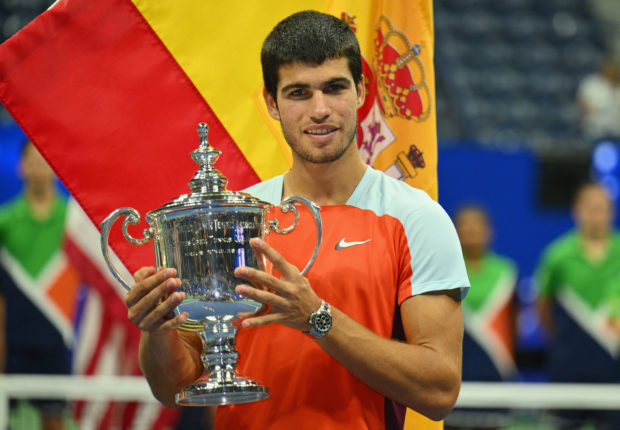 Spain's Carlos Alcaraz celebrates with the trophy after winning against Norway's Casper Ruud during their 2022 US Open Tennis tournament men's singles final match at the USTA Billie Jean King National Tennis Center in New York, on September 11, 2022. (Photo by ANGELA WEISS / AFP)