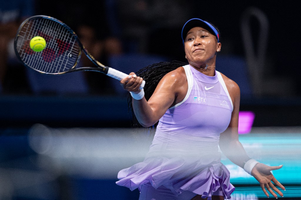 Naomi Osaka of Japan hits a return against Daria Saville of Australia during their women's singles match on day two of the Pan Pacific Open tennis tournament in Tokyo on September 20, 2022. 