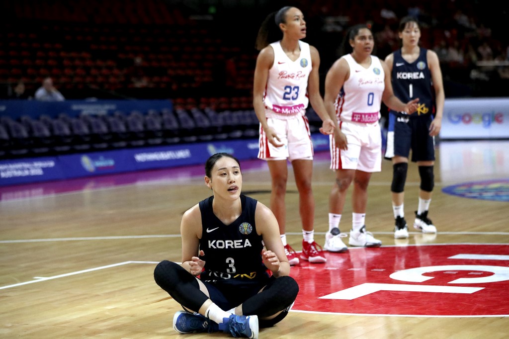South Korea's Kang Lee-seul reacts after a fall during the Women's Basketball World Cup group A game between Puerto Rico and South Korea in Sydney on September 27, 2022. 