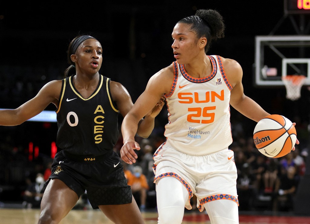 Alyssa Thomas #25 of the Connecticut Sun is guarded by Jackie Young #0 of the Las Vegas Aces during their game at Michelob ULTRA Arena on June 02, 2022 in Las Vegas, Nevada.