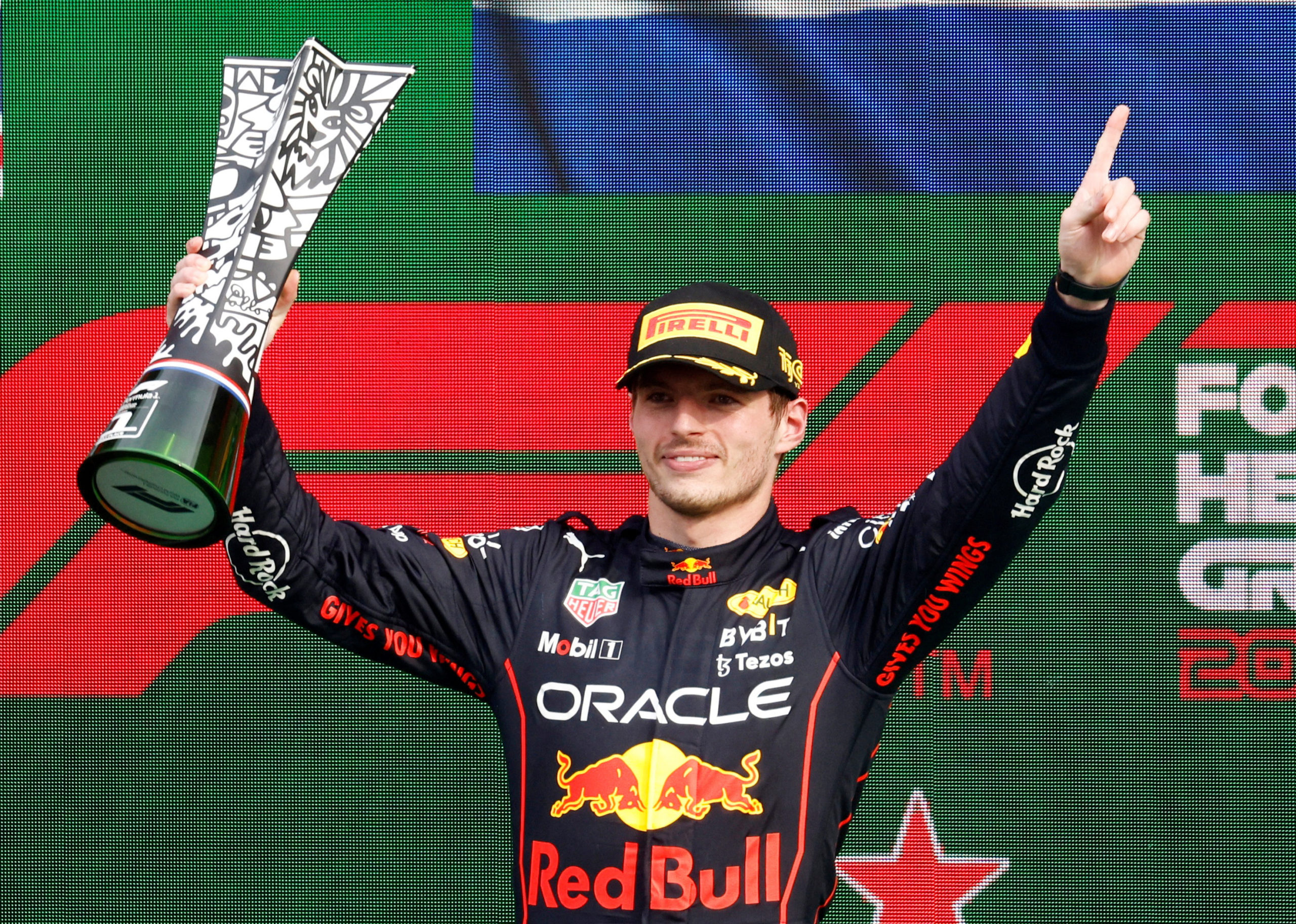 Red Bull's Max Verstappen celebrates on the podium with the trophy after winning the Dutch Grand Prix 