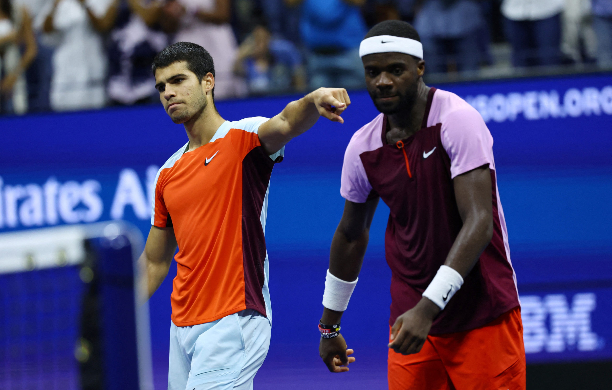 Tennis - U.S. Open - Flushing Meadows, New York, United States - September 9, 2022 Spain's Carlos Alcaraz with Frances Tiafoe of the U.S. after winning their semi final match 