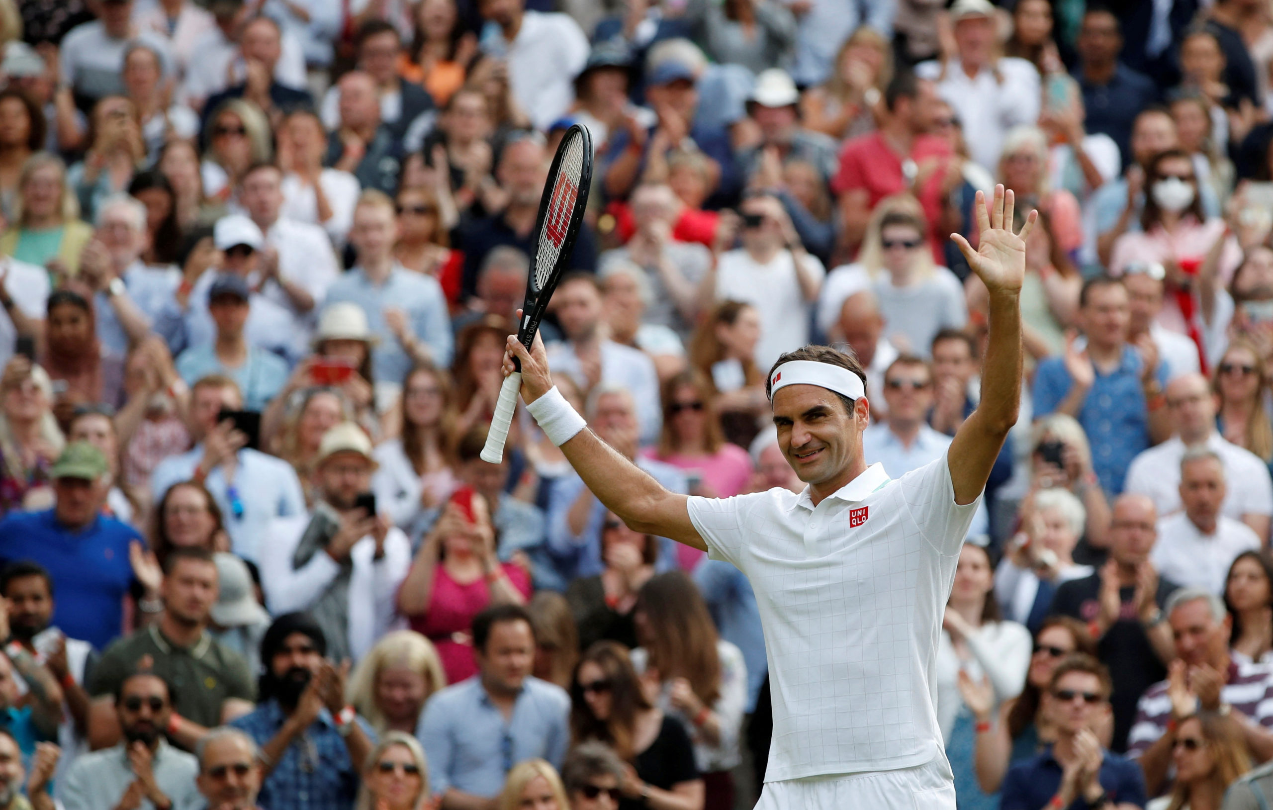 FILE PHOTO: Tennis - Wimbledon - All England Lawn Tennis and Croquet Club, London, Britain - July 1, 2021 Switzerland's Roger Federer celebrates winning his second round match against France's Richard Gasquet 