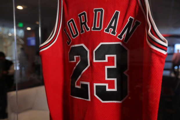 American basketball legend Michael Jordan's jersey from game one of the 1998 NBA Finals, which will go up for auction in September, is seen in a case in Monterey, California, U.S. August 18, 2022. REUTERS/Nathan Frandino