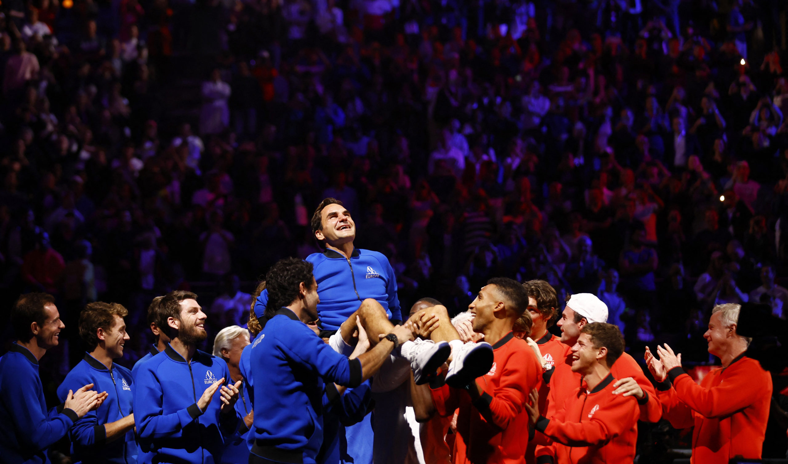 Team Europe and World members lift Roger Federer at the end of his last match after announcing his retirement 