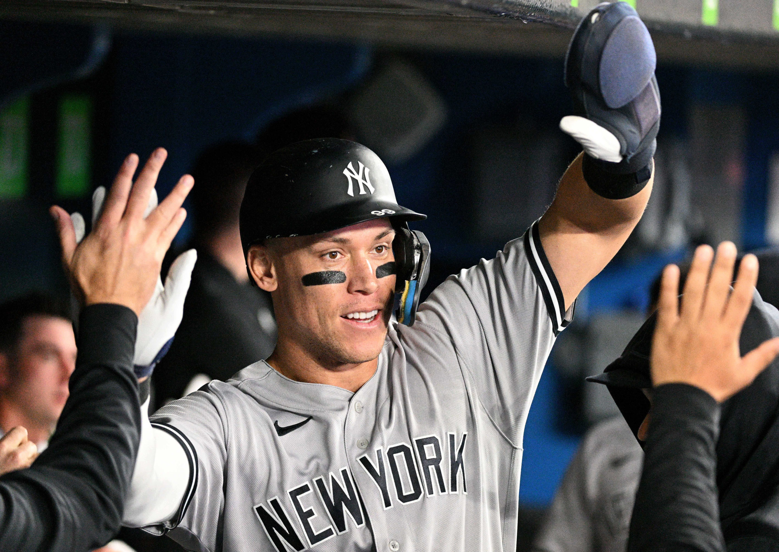 FILE PHOTO: Sep 27, 2022; Toronto, Ontario, CAN; New York Yankees center fielder Aaron Judge (99) celebrates in the dugout with team mates after scoring against the Toronto Blue Jays in the third inning at Rogers Centre.