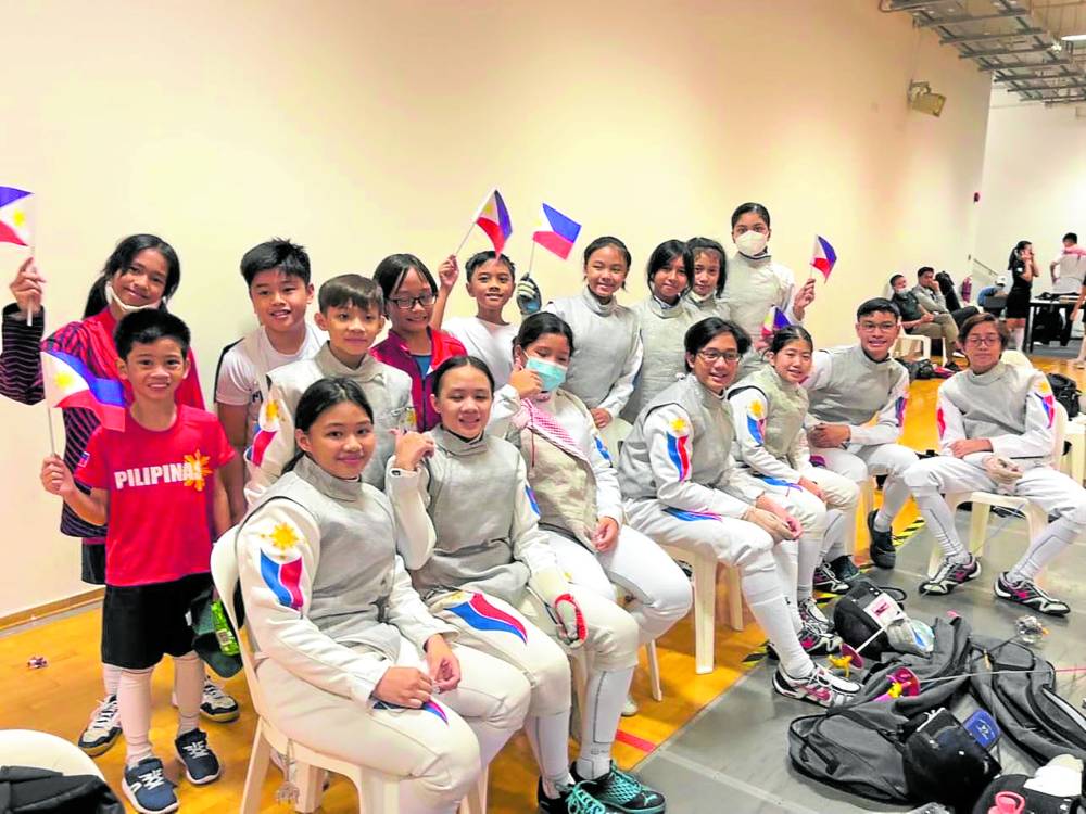 Canlas fencers celebrate a successful stint in Singapore