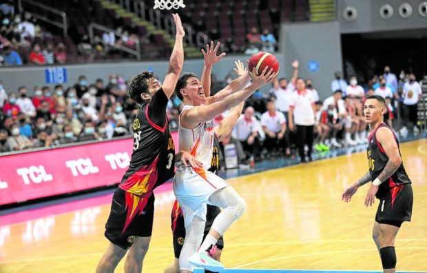 Robert Bolick (right) and the Batang Pier fall short of an upset against the Dragons. —PBA IMAGES