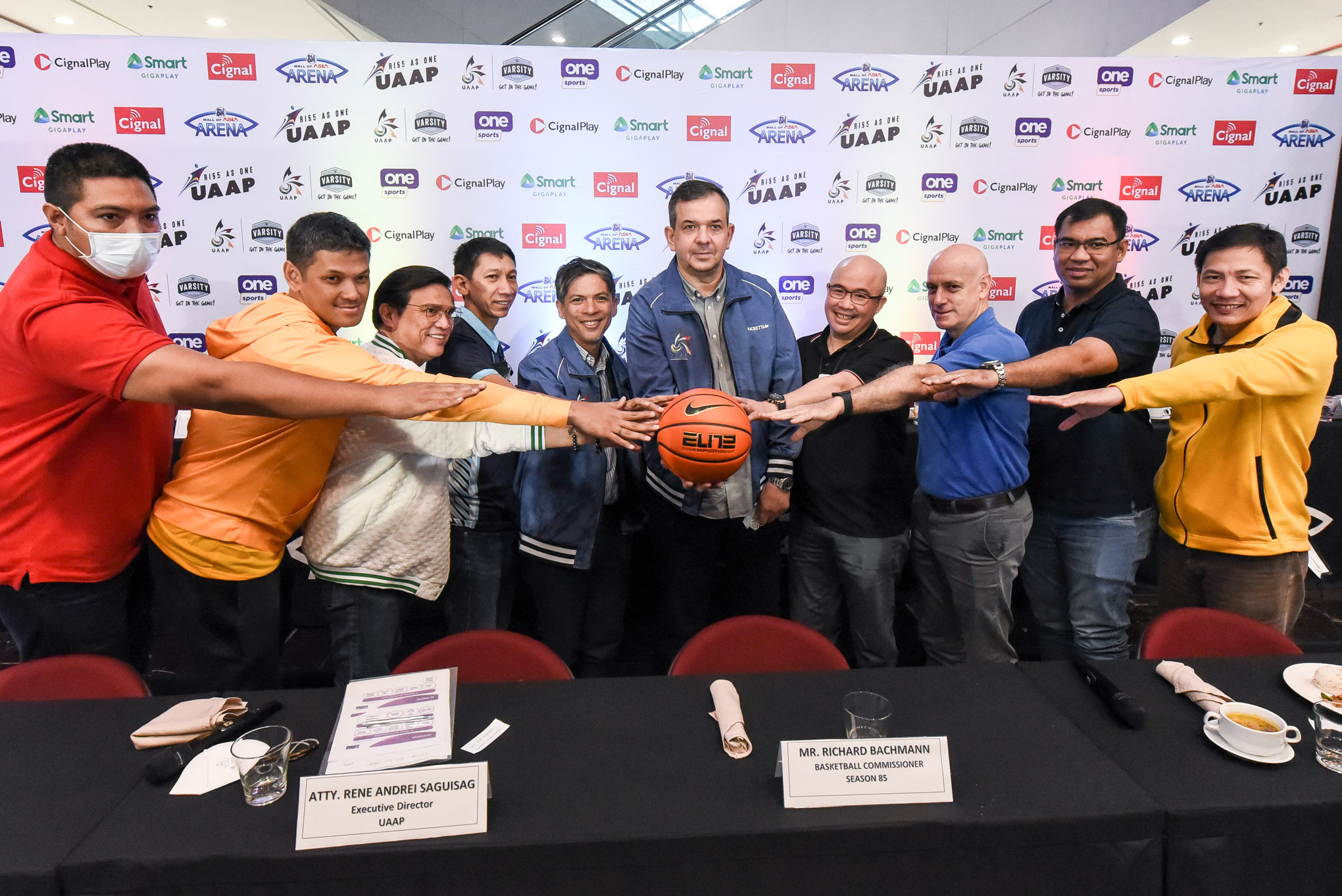UAAP men's basketball coaches with UAAP commissioner Dickie Bachmann during the Season 85 press conference.