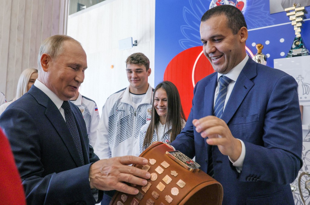 Russia's President Vladimir Putin (L) and International Boxing Assosiation (AIBA) President Umar Kremlev (R) tour the newly opened International Boxing centre at the Luzhniki Sports Complex, in Moscow September 10, 2022. 