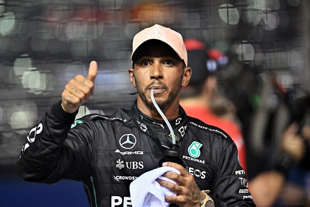 Mercedes' British driver Lewis Hamilton reacts after placing third in the qualifying session ahead of the Formula One Singapore Grand Prix night race at the Marina Bay Street Circuit in Singapore on October 1, 2022. 