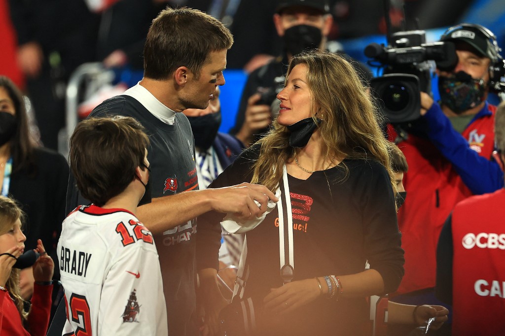 Tom Brady #12 of the Tampa Bay Buccaneers celebrates with Gisele Bundchen after winning Super Bowl LV at Raymond James Stadium on February 07, 2021 in Tampa, Florida. 