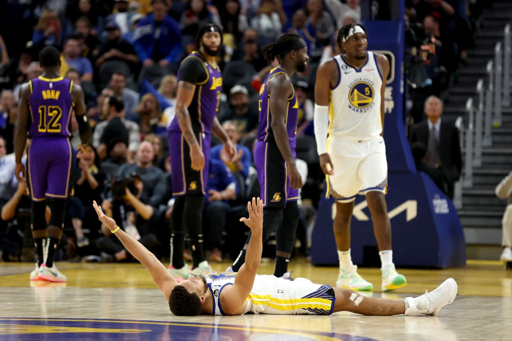 Stephen Curry #30 of the Golden State Warriors reacts after he shot a three-pointer and he was fouled by the Los Angeles Lakers at Chase Center on October 18, 2022 in San Francisco, California. 