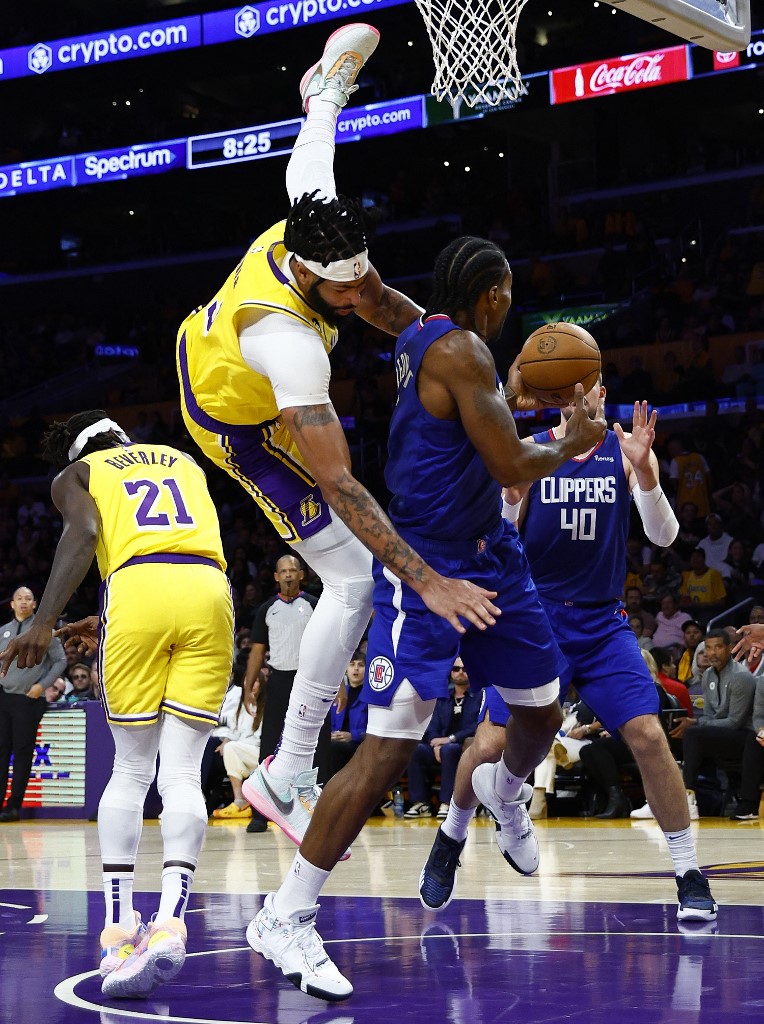 Anthony Davis #3 of the Los Angeles Lakers fouls Kawhi Leonard #2 of the LA Clippers in the third quarter at Crypto.com Arena on October 20, 2022 in Los Angeles, California. 