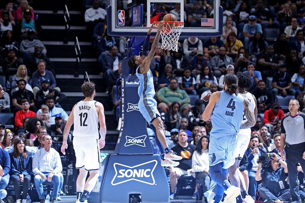     Ja Morant #12 of the Memphis Grizzlies drowns during a game against the Brooklyn Nets at FedExForum on October 24, 2022 in Memphis, Tennessee. 