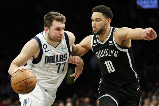 Luka Doncic #77 of the Dallas Mavericks dribbles against Ben Simmons #10 of the Brooklyn Nets during the second half at Barclays Center on October 27, 2022 in the Brooklyn borough of New York City. The Mavericks won 129-125. NOTE TO USER: User expressly acknowledges and agrees that, by downloading and or using this photograph, User is consenting to the terms and conditions of the Getty Images License Agreement. Sarah Stier/Getty Images/AFP (Photo by Sarah Stier / GETTY IMAGES NORTH AMERICA / Getty Images via AFP)