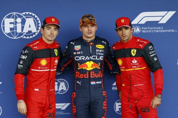 Formula One F1 - Japanese Grand Prix - Suzuka Circuit, Suzuka, Japan - October 8, 2022 Red Bull's Max Verstappen poses as he celebrates qualifying in pole position with second placed Ferrari's Charles Leclerc and third placed Ferrari's Carlos Sainz Jr.