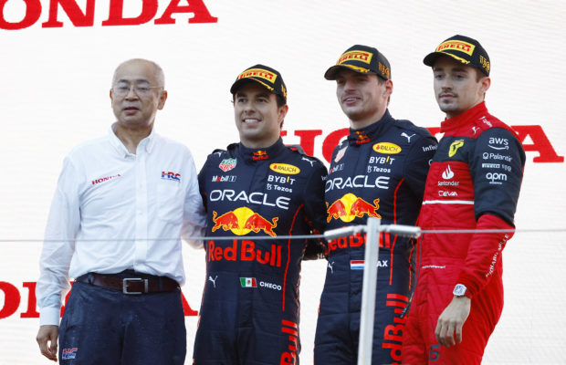 Formula One F1 - Japanese Grand Prix - Suzuka Circuit, Suzuka, Japan - October 9, 2022 Red Bull's Max Verstappen celebrates winning the race and the championship on the podium with second placed Red Bull's Sergio Perez and third placed Ferrari's Charles Leclerc