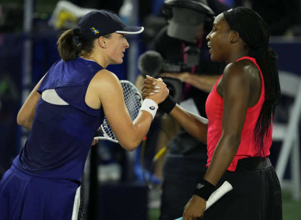 Oct 14, 2022; San Diego, California, US; Iga Swiatek of Poland (left) greets Coco Gauff of the United States (right) after her win during the San Diego Open at Barnes Tennis Center