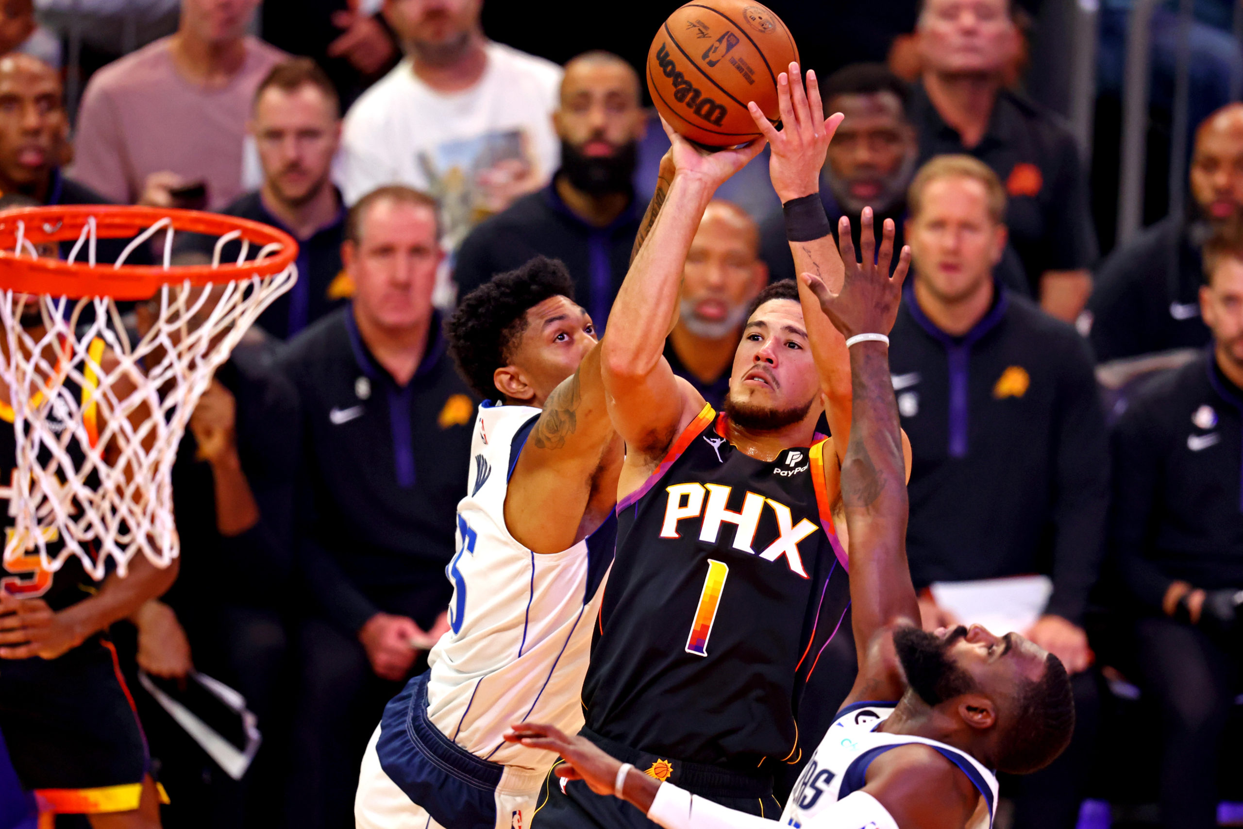  Phoenix Suns guard Devin Booker (1) shoots the ball against Dallas Mavericks center Christian Wood (35) at Footprint Center. 