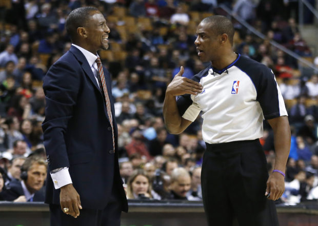 FILE PHOTO: Toronto Raptors' head coach Dwane Casey complains to referee Tony Brown during a break in play against the Utah Jazz during the overtime of their NBA basketball game in Toronto November 12, 2012.  