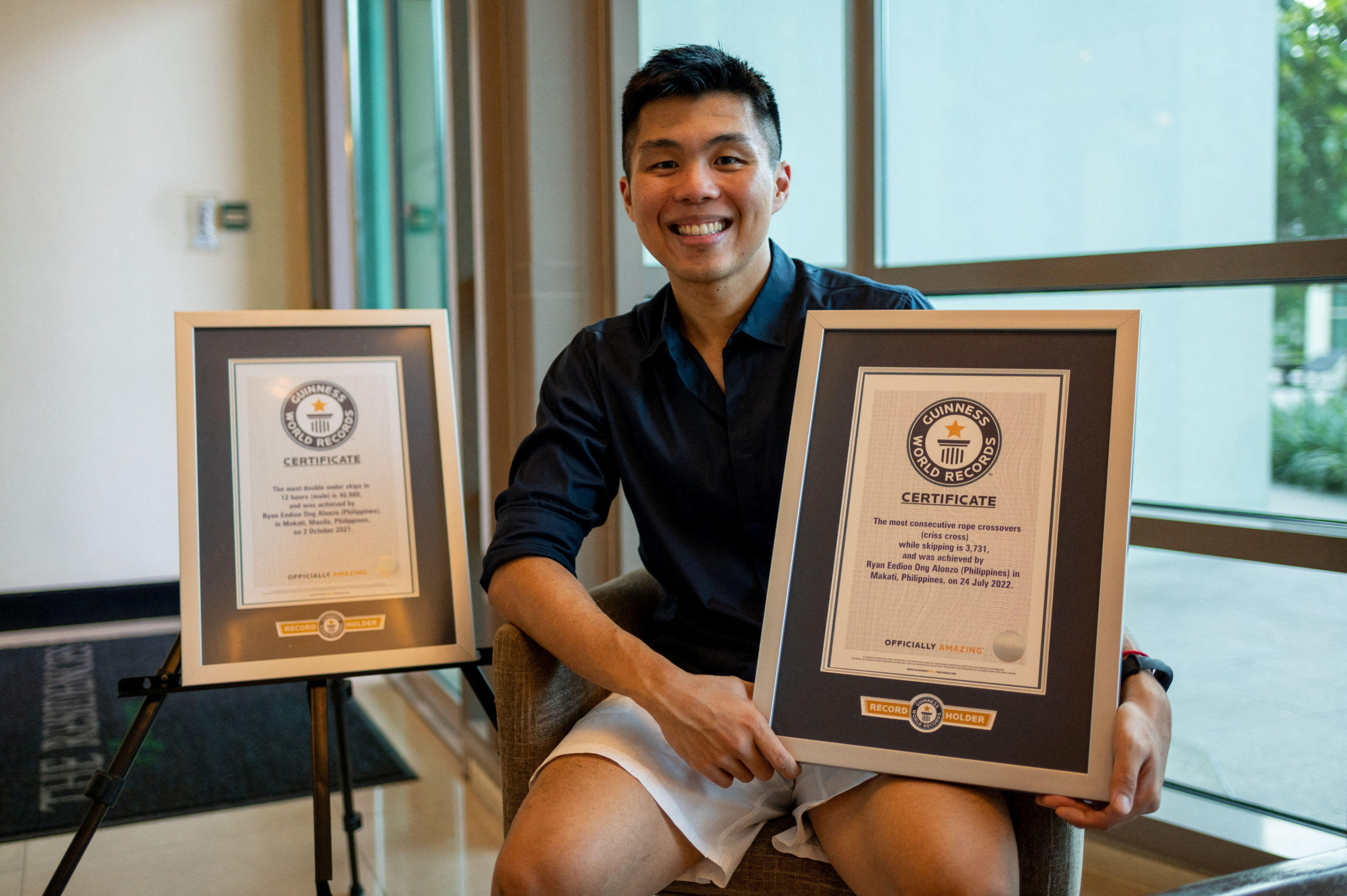 Guinness World Records holder Ryan Alonzo poses with his certificates in Makati City, Metro Manila, Philippines, October 7, 2022. 