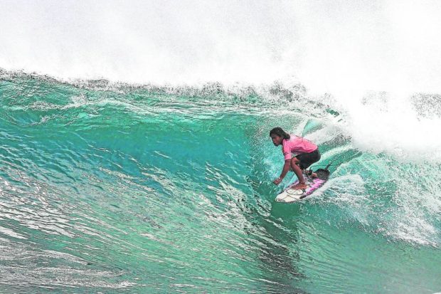 John Mark Tokong shows why he is king of the waves—and a local favorite of Siargao’s surfing crowd.