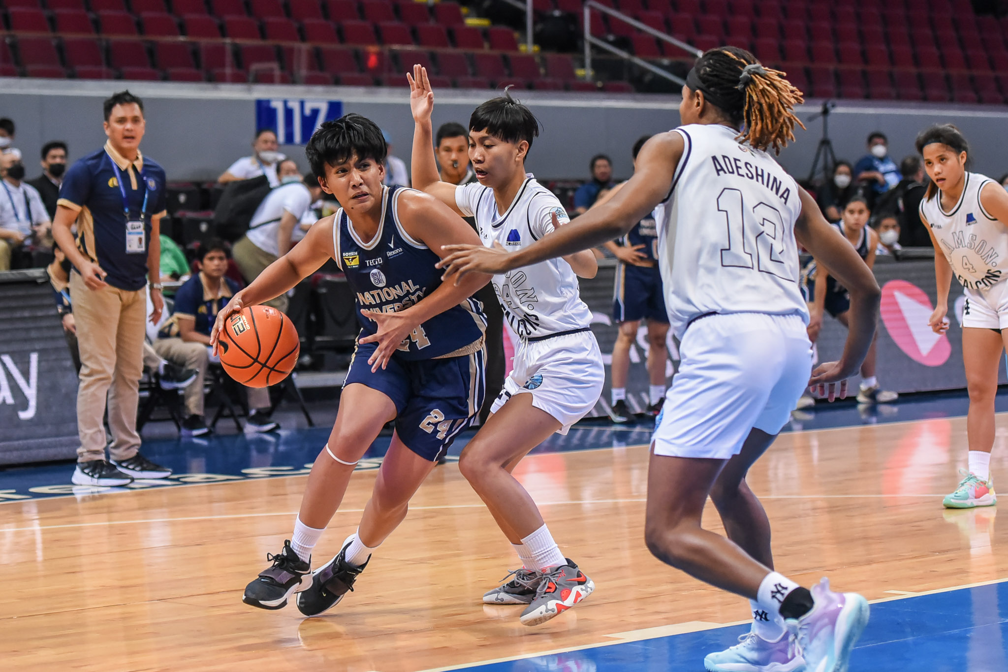 Tin Cayabyab (left) and the Lady Bulldogs kept their foot on the pedal all game long against the Lady Falcons. —UAAP MEDIA.
